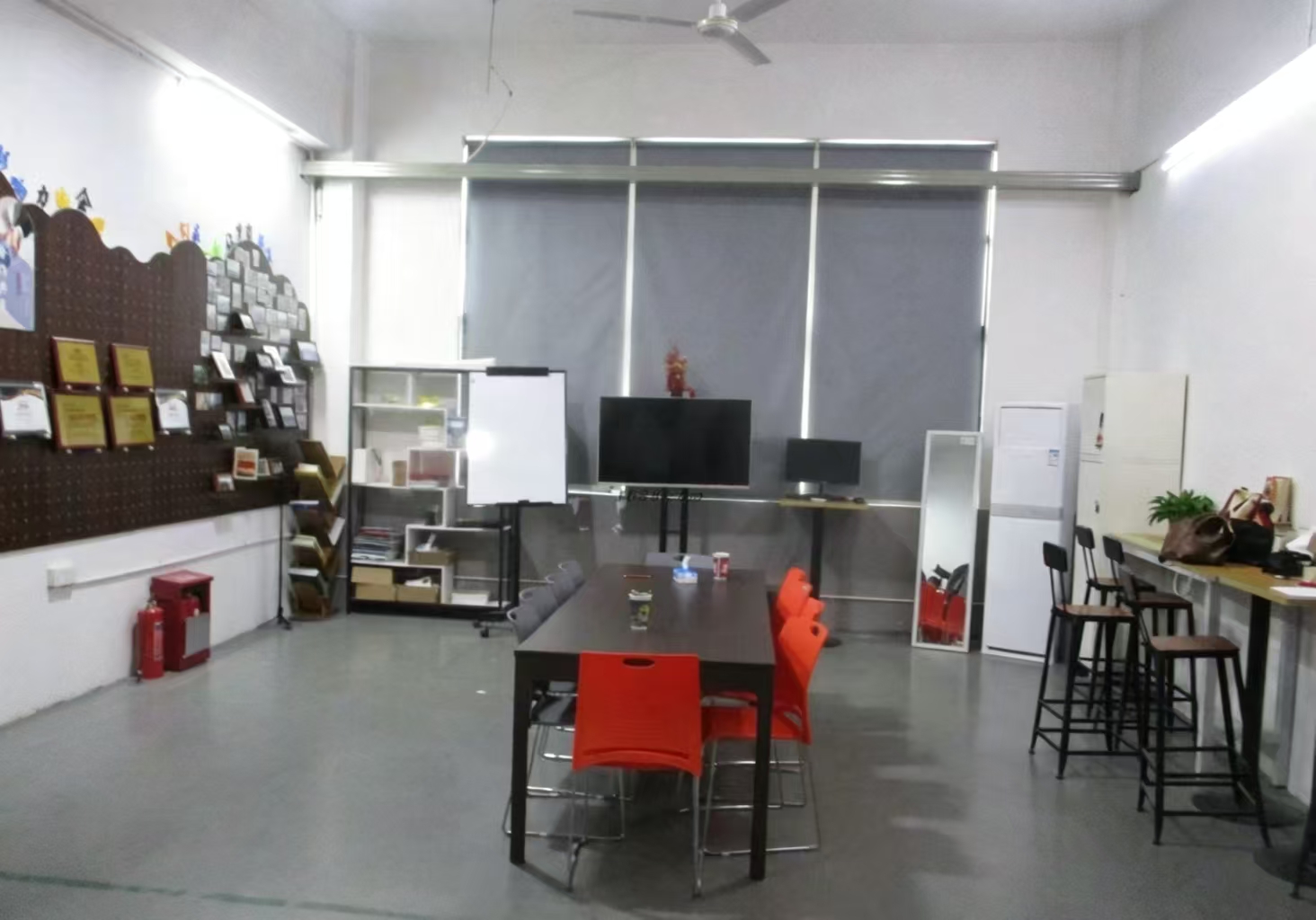 Office and meeting area with company awards